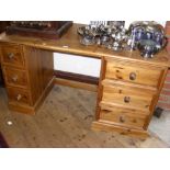 Pine kneehole desk with six drawers to the pedestals