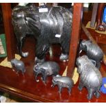 A large carved African wooden elephant ornament, together with others