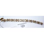 A 9ct gold three bar gate bracelet with padlock clasp