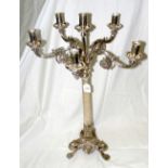 A cast and plated six branch table candelabra with reeded column and Lion's paw tripod supports -