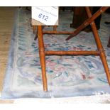 A large Chinese carpet with pale blue ground and central floral medallion - 12ft x 9.5ft