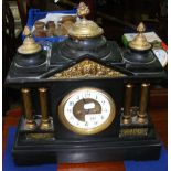 A Victorian slate mantel clock with striking movement - 40cm high