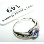 A 9ct white gold tanzanite and diamond ring