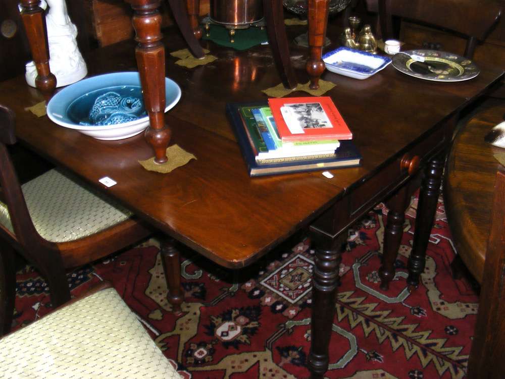 A 124cm x 112cm (flaps up) 19th century mahogany Pembroke table on turned supports