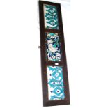 Three mounted 17th century Iznik border tiles