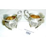 Pair of 800 marked German embossed cherub miniature jugs