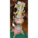 A 47cm high cast bronze two handled vase on marble plinth