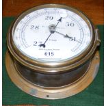 A Kelvin ship's pressure gauge in brass case