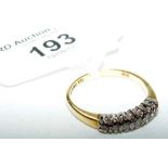 An 18ct yellow gold seven stone diamond half hoop eternity ring