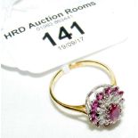 An 18ct yellow gold ruby and diamond cluster ring