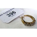 A 9ct yellow gold cubic zirconia five stone ring