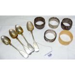 Four fiddle pattern silver teaspoons and five assorted napkin rings