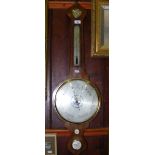 A rosewood cased wheel barometer/thermometer by Spelzini, London