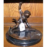 Bronze figure of a cherub "Blacksmith" working on horseshoe, on oval marble base