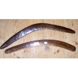 An old wooden boomerang and one other