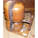 A vintage wooden hat stretcher with calibrations to the base