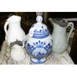 An antique Delft jar and cover, relief ware jugs, etc.