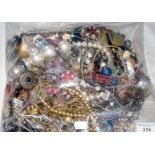 A large bag of assorted costume jewellery