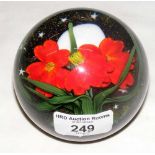 A Lundberg glass paperweight with red flowers 031311