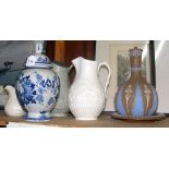 An antique Delft jar and cover, relief ware jugs, etc.