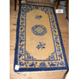 Chinese style carpet with dark blue ground and floral border - 176cm x 94cm