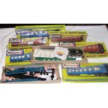 Six unopened boxes of Kitmaster scale model trains