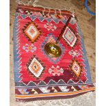 A small Middle Eastern style rug, together with a bed warmer