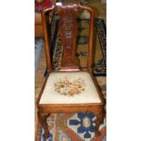 An early walnut side chair with carved back rest and cabriole supports