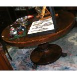 A Victorian rosewood circular dining table on shaped support - 120cm diameter