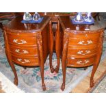 A pair of decorative three drawer bedside tables on cabriole supports