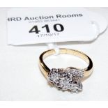 A three stone diamond ring in 9ct gold setting