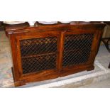 A hardwood side cabinet with metal grille doors