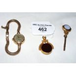 A 9ct gold cased Omega lady's wrist watch and two gold swivel fobs