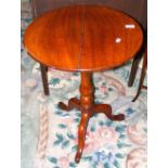 Circular antique tripod table