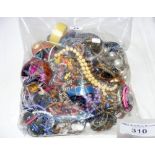 A large bag of assorted costume jewellery