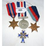 A German war medal, together with three Second World War medals