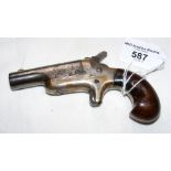An antique starting pistol with wooden grip - 12cm long