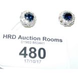 A pair of sapphire and diamond stud earrings in presentation box