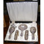 A five piece silver back dressing table set in presentation case