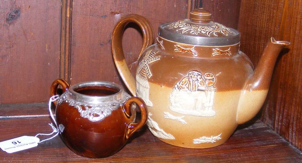 A Doulton Lambeth stoneware teapot with silver mount, together with silver mounted sugar bowl