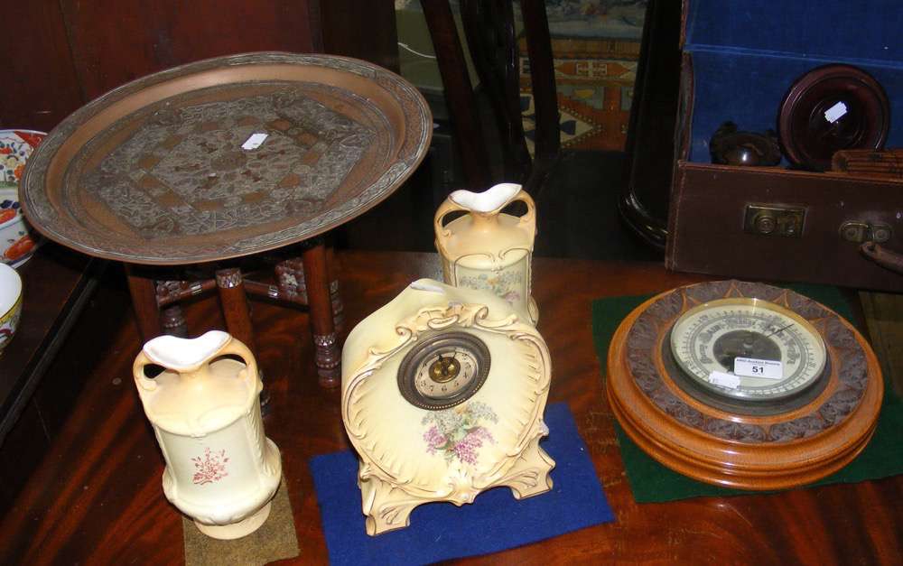 Small Middle Eastern table on folding stand, together with barometer, mantel clock