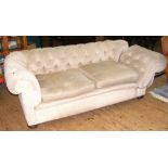 An antique drop-end Chesterfield settee