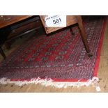 Middle Eastern style carpet with red ground - 250cm x 156cm