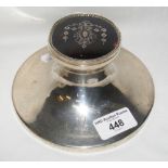 A silver desk inkwell with inlaid tortoiseshell hinged top