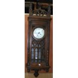 A 19th century Gothic striking wall clock with carved case - 120cm