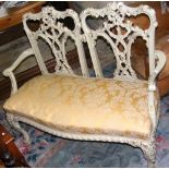 A French two seater drawing room sofa with carved shaped cabriole front supports and backrest