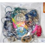 A large bag of assorted costume jewellery