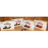 Four boxed Corgi buses