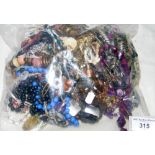 A large bag of assorted costume jewellery