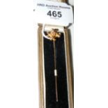 A diamond mounted gold stickpin in presentation case